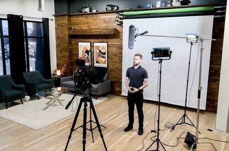 man speaks to teleprompter in kelowna office space