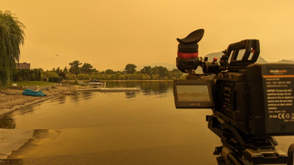 skimmer planes reloading, news camera in foreground